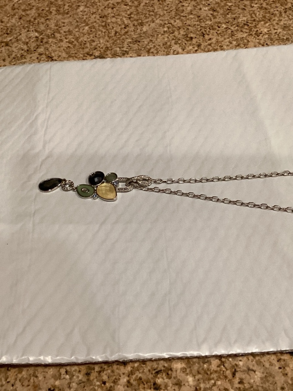 Silver necklace with embellishment of stone